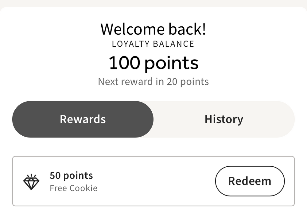 Screenshot of a loyalty app interface for Kyle's Kitchen with points balance and reward options.